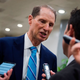 US Senator Ron Wyden, Democrat of Oregon, speaks to reporters as he walks to the chamber to go for a vote on July 17, 2018 on Capitol Hill in Washington, DC.